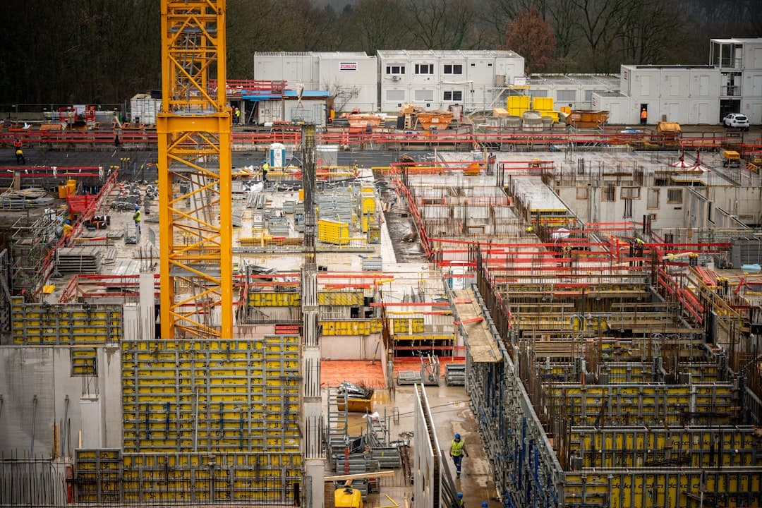 Construction site manager scanning a delivery note in a site cabin