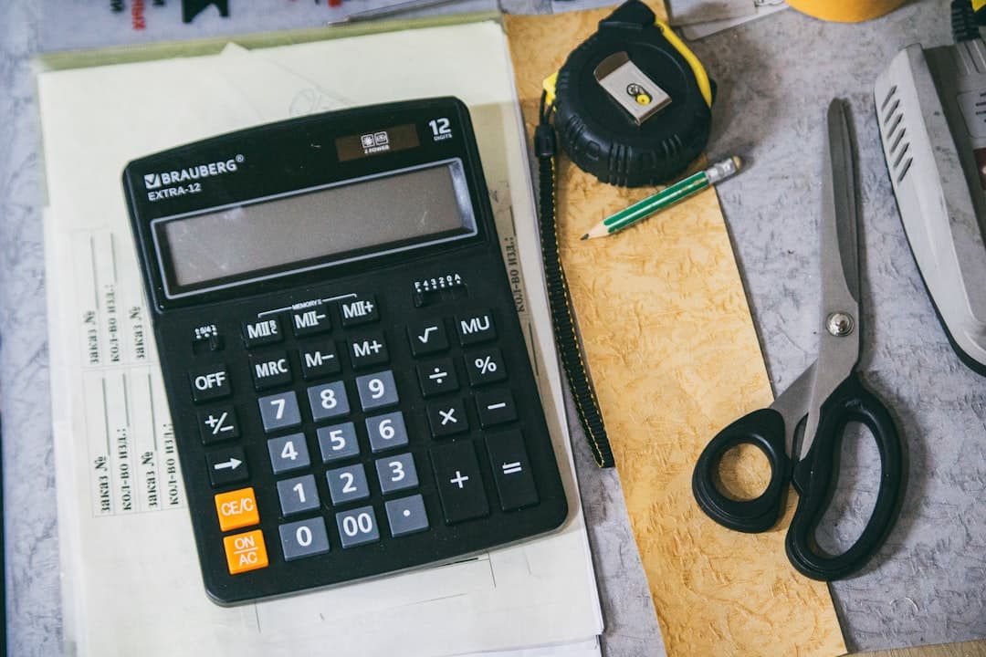Accountant digitising invoices at a modern office desk